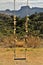 Mountain landscape Pedra do BaÃº in sunny day by swing in the field