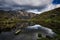 Mountain landscape reflected in lake water surface in the Cordillera Blanca, Huaraz
