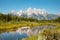 Mountain landscape reflection in the River at Schwabacher`s Landing in Grand Teton National Park, Wyoming. Summer nature landscap