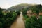 Mountain landscape with river and houses on the shore. Town in the mountains landscape, photo from the bridge. Vorokhta,