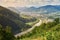 Mountain landscape with river and village views. Carpathians