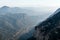 Mountain landscape, rocky cliffs and misty ridges in range