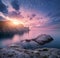 Mountain landscape on the sea at sunset