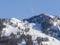 Mountain landscape with ski slopes, ski lifts and half moon