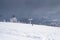 Mountain landscape and snowboarder on a snowy slope