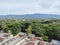 mountain landscape, urban forest, green trees, tall trees, dense trees, shady trees and blue sky