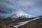 Mountain landscape: view on active Koryaksky Volcano on a sunny day. Koryaksky-Avachinsky Group of Volcanoes, Kamchatka Peninsula,