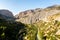 Mountain landscape view of El Chorro narrow gorge at El Caminito del Rey walkway with wild river. Spain