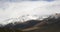 Mountain landscape view in Kyrgyzstan. Rocks, snow and stones in mountain valley view. Mountain panorama. Kyrgyz Alatoo mountains,