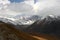 Mountain landscape view in Kyrgyzstan. Rocks, snow and stones in mountain valley view. Mountain panorama. Kyrgyz Alatoo mountains,