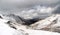 Mountain landscape view in Kyrgyzstan. Rocks, snow and stones in mountain valley view. Mountain panorama. Kyrgyz Alatoo mountains,