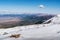 Mountain landscape, view from a snowy mountain peak