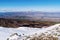 Mountain landscape, view from a snowy mountain peak