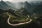 Mountain landscape with winding road in the mist, south china