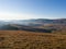 The mountain landscape of the Zlatibor mountain in Serbia seen from the mountain peak Crni vrh