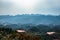 Mountain layers with hazy sky at morning from flat angle