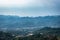 Mountain layers with hazy sky at morning from flat angle