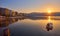 mountain and lonely motor boat reflected sunrise in a calm sea, Marmaris