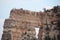 Mountain with a lookout at the top and a triangle-shaped crevice in the middle of the mountain.