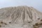 Mountain made from macadam and sand in open-pit mining