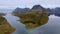 Mountain Majesty: Aerial Perspective from a Lofoten Hill, Revealing Steep Peaks and the Expansive Ocean in Norway