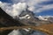 A mountain Matterhorn view partially covered by clouds, on a mountain Gornergrat, near Zermatt, in southern Switzerland