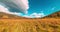 Mountain meadow time-lapse at the summer or autumn time. Wild nature and rural field. Clouds movement, green grass and