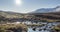 Mountain meadow timelapse at the summer or autumn time. Wild nature and rural valley. Sun rays, small creek and yellow