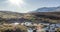 Mountain meadow timelapse at the summer or autumn time. Wild nature and rural valley. Sun rays, small creek and yellow