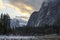 Mountain Meadow Under Dramatic Clouds