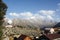 Mountain observatory with solar radio telescope against the background of snow mountains.