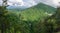 Mountain overgrown with thick green forest