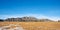 Mountain Panorama with a Grassy Field