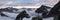 Mountain panorama landscape of the Bernina mountains and glaciers in the Swiss Alps near St. Moritz on a dark and ominous morning