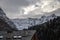 Mountain panorama with peaks, snow, villages, streams and trails