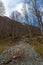 Mountain panorama with peaks, snow, villages, streams and trails