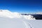 Mountain panorama with snow and snowshoe trail in winter in Stubai Alps