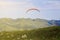 Mountain parasailing, Skydiving flying over the mountains. parachute extreme sport
