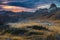 Mountain pass with high peaks at sunset, Dolomites, Italy