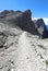 mountain path made of stones to reach the peaks of the Dolomites