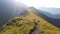 Mountain path and marking pole that leads to Bucsoiu peak