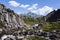 Mountain path to the blue lake of chianale, in the italian alps of Cuneo, Piedmont, with the famous peak of monviso