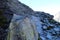 Mountain pathway secured with chain near Rysy peak, High Tatras