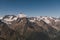 Mountain peak Belalakaya with clouds and blue sky. Wild nature view. Dombay ski resort, Russia, Caucasus mountain.