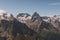 Mountain peak Belalakaya with clouds and blue sky. Wild nature view. Dombay ski resort, Russia, Caucasus mountain.