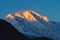 Mountain peak with first sunlight during sunrise on top in the morning. Rakaposhi mountain peak in Pakistan