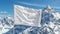 Mountain peak with flag waving in the wind against a serene blurred natural backdrop