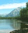 Mountain peak overlooking a lake.