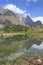 Mountain peak reflection in alpine lake