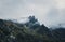 Mountain peak shrouded in storm clouds